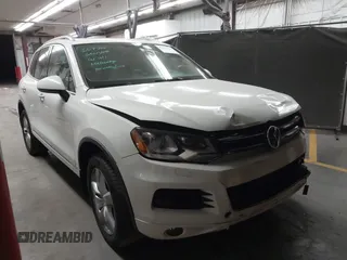2012 Volkswagen Touareg Sport with VIN WVGFK9BP2CD002991, listed as a IAAI auction lot 42077523 with 94,515 mi miles and . Bid and sale history available at DreamBid. Image 1.