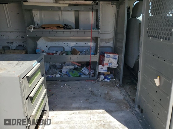 2016 Ford Transit Cargo z VIN 1FTYE1YM1GKA44590, wystawiony jako Copart lot #53102675 z przebiegiem 179 687 mil mil oraz Szkoda całkowita • Salvage title. Historia ofert i sprzedaży dostępna na DreamBid. Obrazek 11.