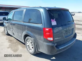2014 Dodge Grand Caravan SXT with VIN 2C4RDGCG1ER167624, listed as a IAAI auction lot 41888822 with 202,729 mi miles and . Bid and sale history available at DreamBid. Image 3.