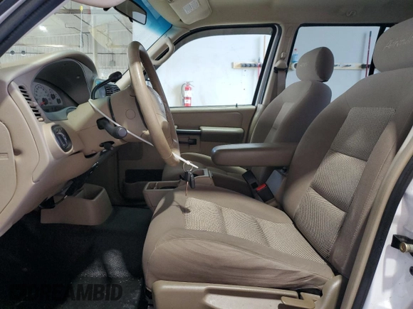 2004 Ford Explorer Sport Trac XLS with VIN 1FMZU77K74UB23543, listed as a Copart auction lot 62859625 with 96,873 mi miles and Salvage title. Bid and sale history available at DreamBid. Image 7.