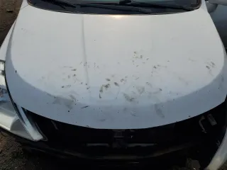 2011 Nissan Versa S z VIN 3N1BC1CP9BL494673, wystawiony jako Copart lot #59898515 z przebiegiem 197 127 mil mil oraz Szkoda całkowita • Salvage title. Historia ofert i sprzedaży dostępna na DreamBid. Obrazek 11.