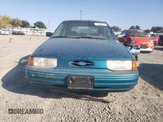 1995 Ford Escort z VIN 1FASP14J9SW304866, wystawiony jako Copart lot #73006174 z przebiegiem 126 068 mil mil oraz Szkoda całkowita • Salvage title. Historia ofert i sprzedaży dostępna na DreamBid. Obrazek 5.