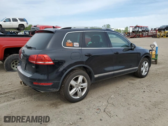 2012 Volkswagen Touareg Sport with VIN WVGFF9BP8CD001039, listed as a Copart auction lot 57764125 with 128,540 mi miles and Clean title. Bid and sale history available at DreamBid. Image 3.