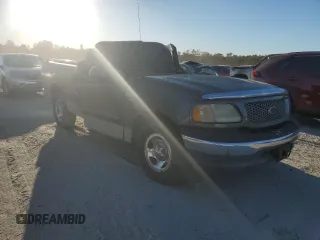 2002 Ford F-150 XL with VIN 1FTRF17W42NA89079, listed as a Copart auction lot 76519634 with Not Provided miles and Salvage Title. Bid and sale history available at carsss.com. Image 4.