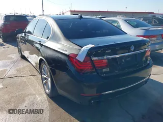 2013 BMW 7 Series 740i with VIN WBAYA6C55DC995094, listed as a IAAI auction lot 41246796 with 164,394 mi miles. Bid and sale history available at carsss.com. Image 3.