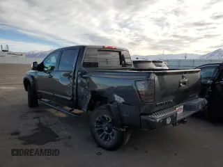 2013 Nissan Titan Pro-4X with VIN 1N6BA0EC2DN305708, listed as a Copart auction lot 45329275 with 68,636 mi miles and Salvage title. Bid and sale history available at DreamBid. Image 2.