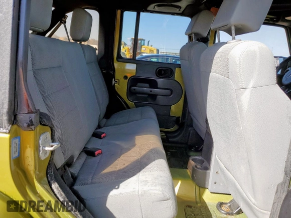 2007 Jeep Wrangler Unlimited Sahara z VIN 1J4GB591X7L165493, wystawiony jako Copart lot #47468205 z przebiegiem Nie podano mil oraz Czysty tytuł • Clean title. Historia ofert i sprzedaży dostępna na DreamBid. Obrazek 10.