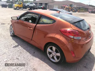 2012 Hyundai Veloster w/Gray Int z VIN KMHTC6AD7CU030176, wystawiony jako IAAI lot #36994035 z przebiegiem Nie podano mil oraz . Historia ofert i sprzedaży dostępna na DreamBid. Obrazek 3.