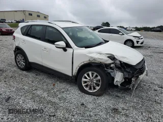 2016 Mazda CX-5 Sport with VIN JM3KE2BY0G0843786, listed as a Copart auction lot 54451275 with 111,363 mi miles and Salvage title. Bid and sale history available at DreamBid. Image 4.