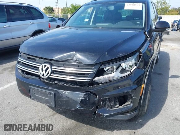 2015 Volkswagen Tiguan SE with VIN WVGAV7AX5FW509612, listed as a IAAI auction lot 42020599 with 64,201 mi miles and . Bid and sale history available at DreamBid. Image 6.