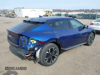 2022 Kia EV6 Wind z VIN KNDC3DLCXN5068642, wystawiony jako IAAI lot #41774075 z przebiegiem 17 632 mil mil oraz . Historia ofert i sprzedaży dostępna na DreamBid. Obrazek 4.