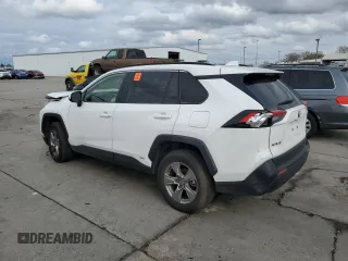 2023 Toyota RAV4 Hybrid LE with VIN JTMMWRFV3PD570648, listed as a Copart auction lot 86983174 with 27,258 mi miles and Salvage title. Bid and sale history available at DreamBid. Image 2.