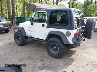 1999 Jeep Wrangler Sport with VIN 1J4FY19S1XP417362, listed as a IAAI auction lot 42738296 with 228,066 mi miles and . Bid and sale history available at DreamBid. Image 3.