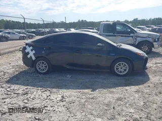2021 Toyota Prius L Eco z VIN JTDKAMFU6M3141392, wystawiony jako IAAI lot #42317866 z przebiegiem 137 495 mil mil oraz . Historia ofert i sprzedaży dostępna na DreamBid. Obrazek 12.