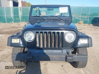 2004 Jeep Wrangler SE with VIN 1J4FA29144P797861, listed as a IAAI auction lot 42624721 with 156,867 mi miles and . Bid and sale history available at DreamBid. Image 6.