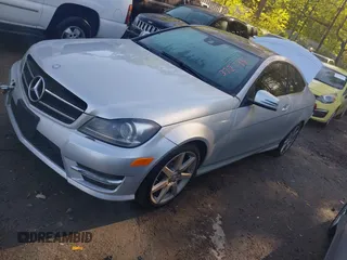 2015 Mercedes-Benz C with VIN WDDGJ4HB1FG372798, listed as a IAAI auction lot 41968536 with 56,007 mi miles. Bid and sale history available at carsss.com. Image 2.