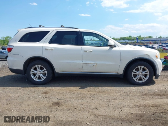 2012 Dodge Durango SXT z VIN 1C4RDJAG0CC294998, wystawiony jako IAAI lot #42230396 z przebiegiem 62 963 mil mil oraz . Historia ofert i sprzedaży dostępna na DreamBid. Obrazek 13.
