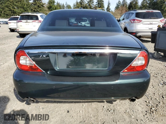2008 Jaguar XJ with VIN SAJWA79BX8SH23430, listed as a Copart auction lot 51990785 with 140,454 mi miles and Salvage Title. Bid and sale history available at carsss.com. Image 6.