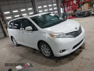 2015 Toyota Sienna XLE with VIN 5TDYK3DC8FS598525, listed as a IAAI auction lot 41918825 with 128,557 mi miles. Bid and sale history available at carsss.com. Image 1.