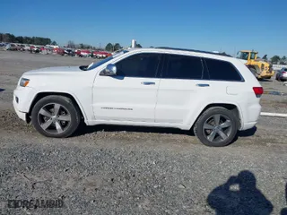 2014 Jeep Grand Cherokee Overland with VIN 1C4RJFCG9EC587322, listed as a IAAI auction lot 41632299 with 161,779 mi miles. Bid and sale history available at carsss.com. Image 14.