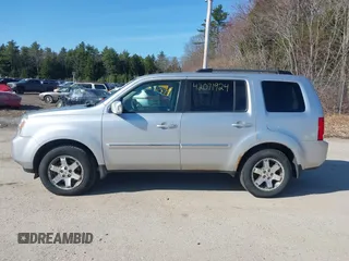 2011 Honda Pilot Touring with VIN 5FNYF4H96BB012122, listed as a IAAI auction lot 42071924 with 211,000 mi miles. Bid and sale history available at carsss.com. Image 14.