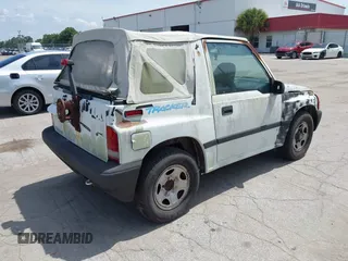 1996 Chevrolet Tracker z VIN 2CNBE1862T6948982, wystawiony jako IAAI lot #42719225 z przebiegiem 257 760 mil mil oraz . Historia ofert i sprzedaży dostępna na DreamBid. Obrazek 4.