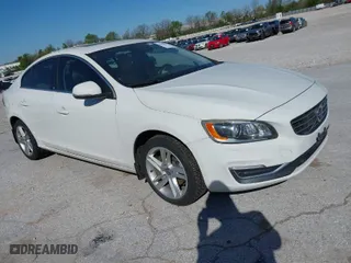 2015 Volvo S60 T5 Drive-E Platinum with VIN YV140MFM7F1346644, listed as a IAAI auction lot 41984716 with 78,210 mi miles. Bid and sale history available at carsss.com. Image 1.