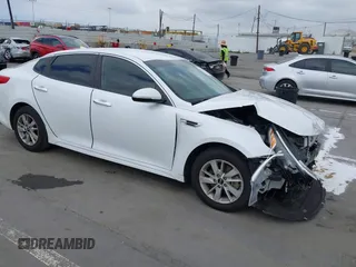 2016 Kia Optima LX z VIN 5XXGT4L32GG064990, wystawiony jako IAAI lot #42139627 z przebiegiem 86 401 mil mil oraz . Historia ofert i sprzedaży dostępna na DreamBid. Obrazek 1.