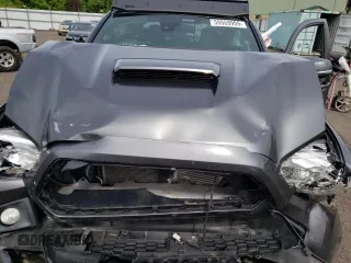 2019 Toyota Tacoma SR z VIN 3TMCZ5AN6KM283109, wystawiony jako Copart lot #58668905 z przebiegiem 44 923 mil mil oraz Szkoda całkowita • Salvage title. Historia ofert i sprzedaży dostępna na DreamBid. Obrazek 11.
