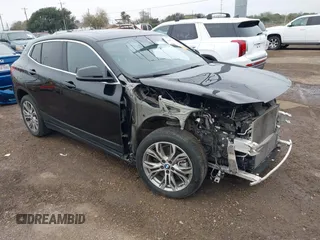 2022 BMW X2 xDrive28i with VIN WBXYJ1C01N5U20171, listed as a IAAI auction lot 41284932 with 64,256 mi miles. Bid and sale history available at carsss.com. Image 1.