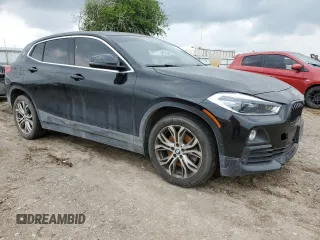 2019 BMW X2 sDrive28i with VIN WBXYJ3C52K5N14885, listed as a Copart auction lot 54079395 with 91,564 mi miles and Salvage title. Bid and sale history available at DreamBid. Image 4.