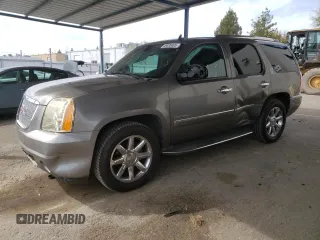 2012 GMC Yukon Denali with VIN 1GKS1EEFXCR236823, listed as a Copart auction lot 49830405 with 134,568 mi miles and Salvage Title. Bid and sale history available at carsss.com. Image 1.