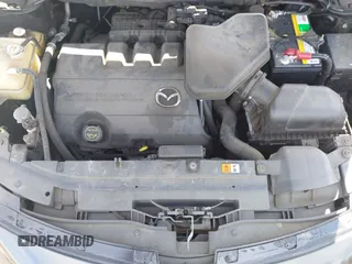 2015 Mazda CX-9 Grand Touring z VIN JM3TB2DA4F0450014, wystawiony jako IAAI lot #41692935 z przebiegiem 90 800 mil mil oraz . Historia ofert i sprzedaży dostępna na DreamBid. Obrazek 10.