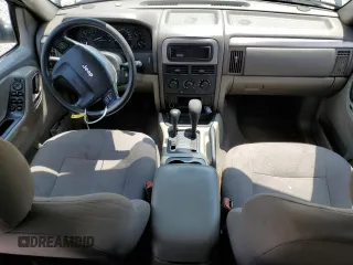 2004 Jeep Grand Cherokee Laredo with VIN 1J4GW48S64C121057, listed as a Copart auction lot 67765474 with 166,359 mi miles and Salvage title. Bid and sale history available at DreamBid. Image 8.