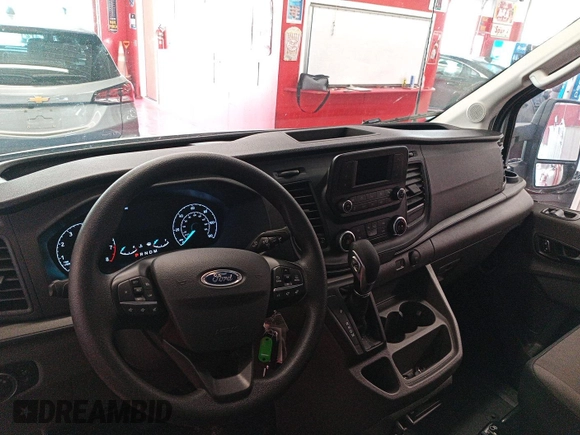 2023 Ford Transit Cargo z VIN 1FTBR1X8XPKC02486, wystawiony jako IAAI lot #42786968 z przebiegiem 7 229 mil mil oraz . Historia ofert i sprzedaży dostępna na DreamBid. Obrazek 8.