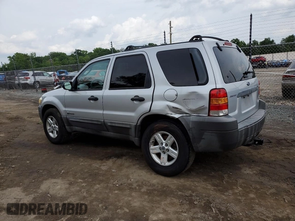 2005 Ford Escape Hybrid with VIN 1FMCU96H55KC74059, listed as a Copart auction lot 57065685 with 154,807 mi miles and Salvage title. Bid and sale history available at DreamBid. Image 2.