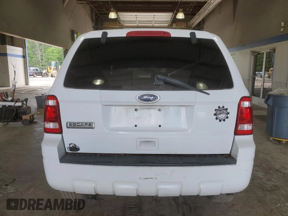 2010 Ford Escape XLS with VIN 1FMCU9C75AKD02318, listed as a Copart auction lot 59130055 with Not provided miles and Salvage title. Bid and sale history available at DreamBid. Image 6.