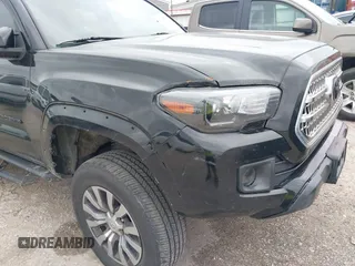2017 Toyota Tacoma SR5 with VIN 5TFAZ5CN8HX052459, listed as a IAAI auction lot 41495281 with 212,314 mi miles and . Bid and sale history available at DreamBid. Image 6.