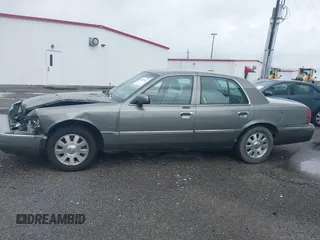 2004 Mercury Grand Marquis LS Premium z VIN 2MEHM75W64X654827, wystawiony jako IAAI lot #41890046 z przebiegiem Nie podano mil oraz . Historia ofert i sprzedaży dostępna na DreamBid. Obrazek 14.
