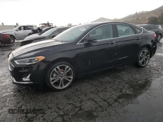 2020 Ford Fusion Titanium with VIN 3FA6P0D94LR153375, listed as a Copart auction lot 59609415 with 104,292 mi miles and Clean title. Bid and sale history available at DreamBid. Image 1.