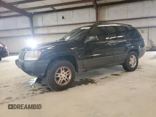 2003 Jeep Grand Cherokee Laredo with VIN 1J4GX48S13C601387, listed as a Copart auction lot 60544295 with 217,485 mi miles and Salvage title. Bid and sale history available at DreamBid. Image 1.