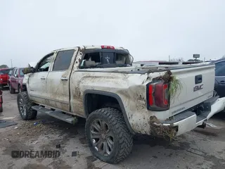 2014 GMC Sierra 1500 Denali z VIN 3GTU2WEJ5EG492544, wystawiony jako IAAI lot #41644535 z przebiegiem 215 469 mil mil oraz . Historia ofert i sprzedaży dostępna na DreamBid. Obrazek 3.