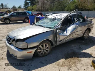2005 Kia Optima LX z VIN KNAGD128655393523, wystawiony jako Copart lot #50534405 z przebiegiem 74 930 mil mil oraz Szkoda całkowita • Salvage title. Historia ofert i sprzedaży dostępna na DreamBid. Obrazek 1.