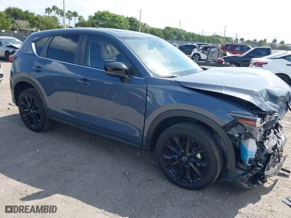 2023 Mazda CX-5 2.5 S Carbon Edition with VIN JM3KFBCM1P0106881, listed as a IAAI auction lot 41610768 with 21,184 mi miles. Bid and sale history available at carsss.com. Image 1.
