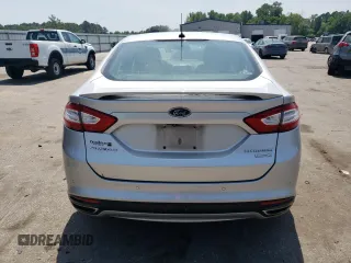 2014 Ford Fusion Titanium с VIN 3FA6P0K90ER363283, выставлен на аукционе Copart как лот 55156795 с пробегом 54 099 миль миль и Списание • Salvage title. История ставок и продаж доступна на DreamBid. Изображение 6.