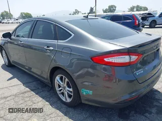 2016 Ford Fusion Titanium with VIN 3FA6P0SU1GR304590, listed as a IAAI auction lot 42381545 with 136,684 mi miles and . Bid and sale history available at DreamBid. Image 3.