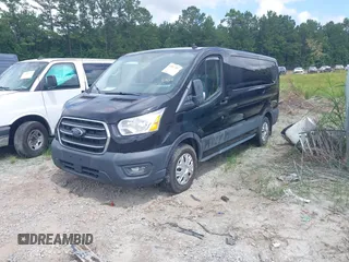 2020 Ford Transit Cargo with VIN 1FTYE1Y86LKA27345, listed as a IAAI auction lot 42577599 with 67,182 mi miles and . Bid and sale history available at DreamBid. Image 2.