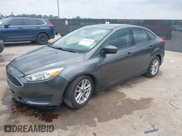 2018 Ford Focus SE z VIN 1FADP3F23JL321768, wystawiony jako IAAI lot #42415788 z przebiegiem 124 126 mil mil oraz . Historia ofert i sprzedaży dostępna na DreamBid. Obrazek 17.