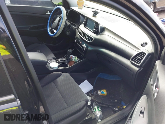 2019 Hyundai Tucson SE with VIN KM8J2CA46KU977863, listed as a IAAI auction lot 41704318 with 23,076 mi miles. Bid and sale history available at carsss.com. Image 5.