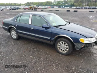2002 Lincoln Continental z VIN 1LNHM97V62Y698904, wystawiony jako IAAI lot #42230916 z przebiegiem 79 009 mil mil oraz . Historia ofert i sprzedaży dostępna na DreamBid. Obrazek 1.